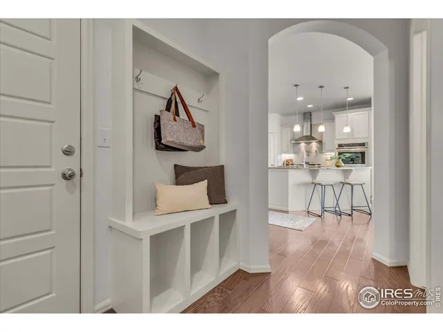 a view of kitchen with furniture and wooden floor