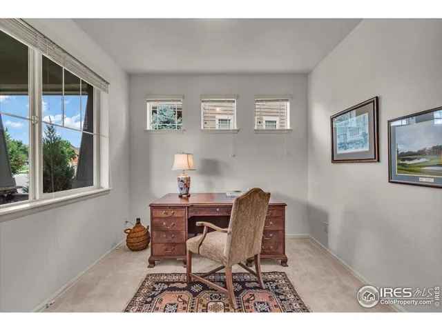 a workspace with furniture and window