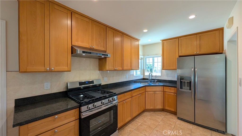 4432 Ranger Avenue El Monte, CA 91731 - Photo 15 of 24 Kitchen with new stove, oven, & hood. Ample counter and cabinet spaces.