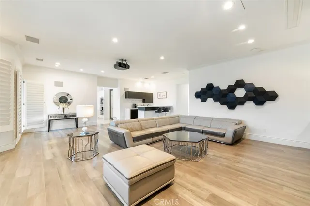 a white bath tub sitting in a bathroom next to a window