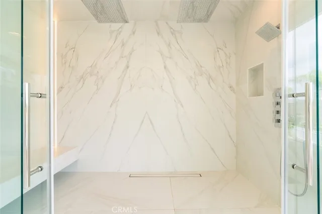 a bedroom with a bed and a view of closet