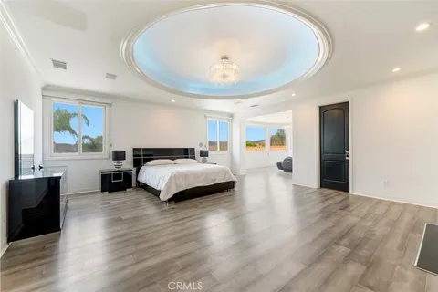 a bedroom with a large bed and a window