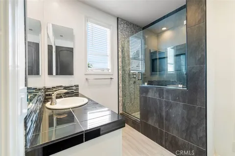 a view of a house with swimming pool and sitting area