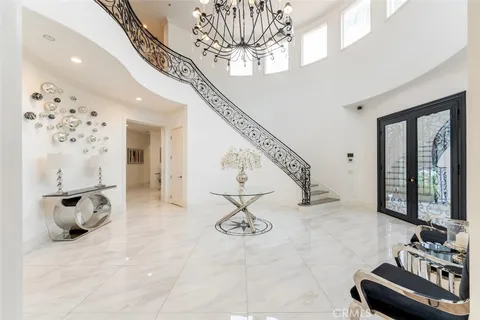 a view of hall way with furniture