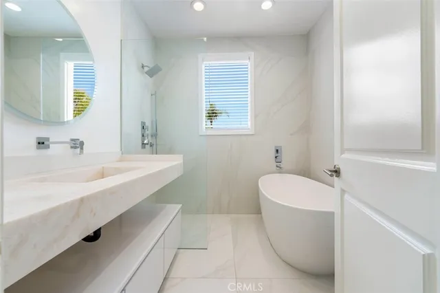 a view of a house with swimming pool and sitting area