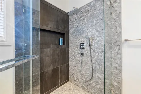 a view of a table and chairs in patio of a lake