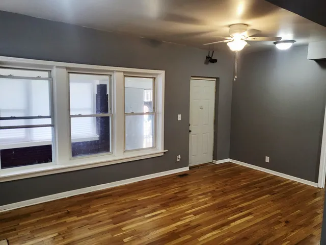 a view of a room with a large window