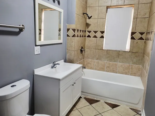 a kitchen with a refrigerator and window