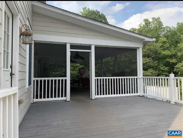 a front view of a house with a yard table and chairs