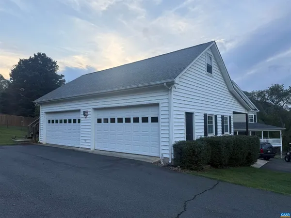 a living room with furniture flat screen tv and a fireplace