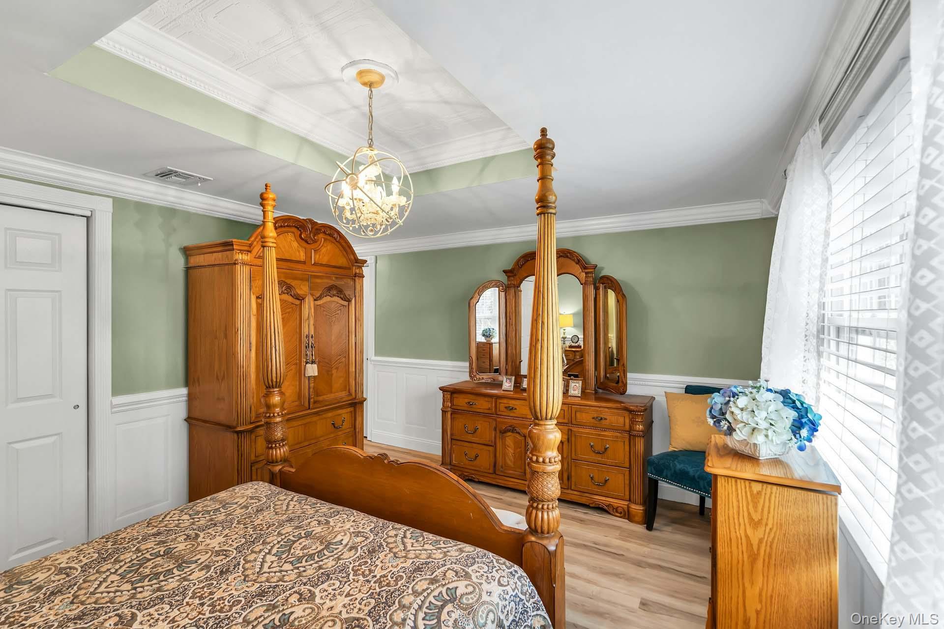 71 Ridge Haven Drive Ridge, NY 11961 - Photo 11 of 23 Primary Bedroom With Crown Molding & Wainscot