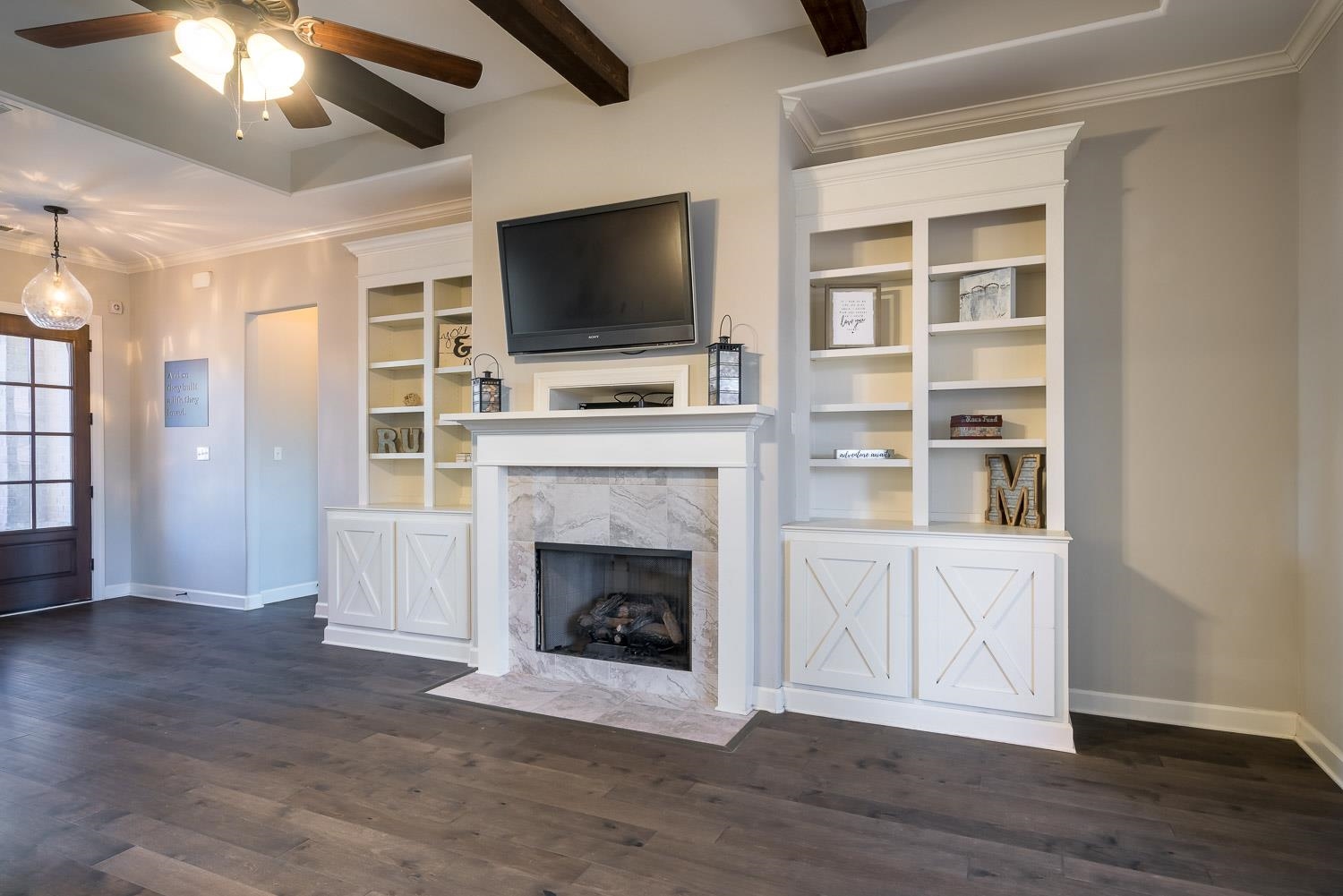 1280 Mountain Side Drive Collierville, TN 38017 - Photo 6 of 25 a living room with a fireplace and a flat screen tv