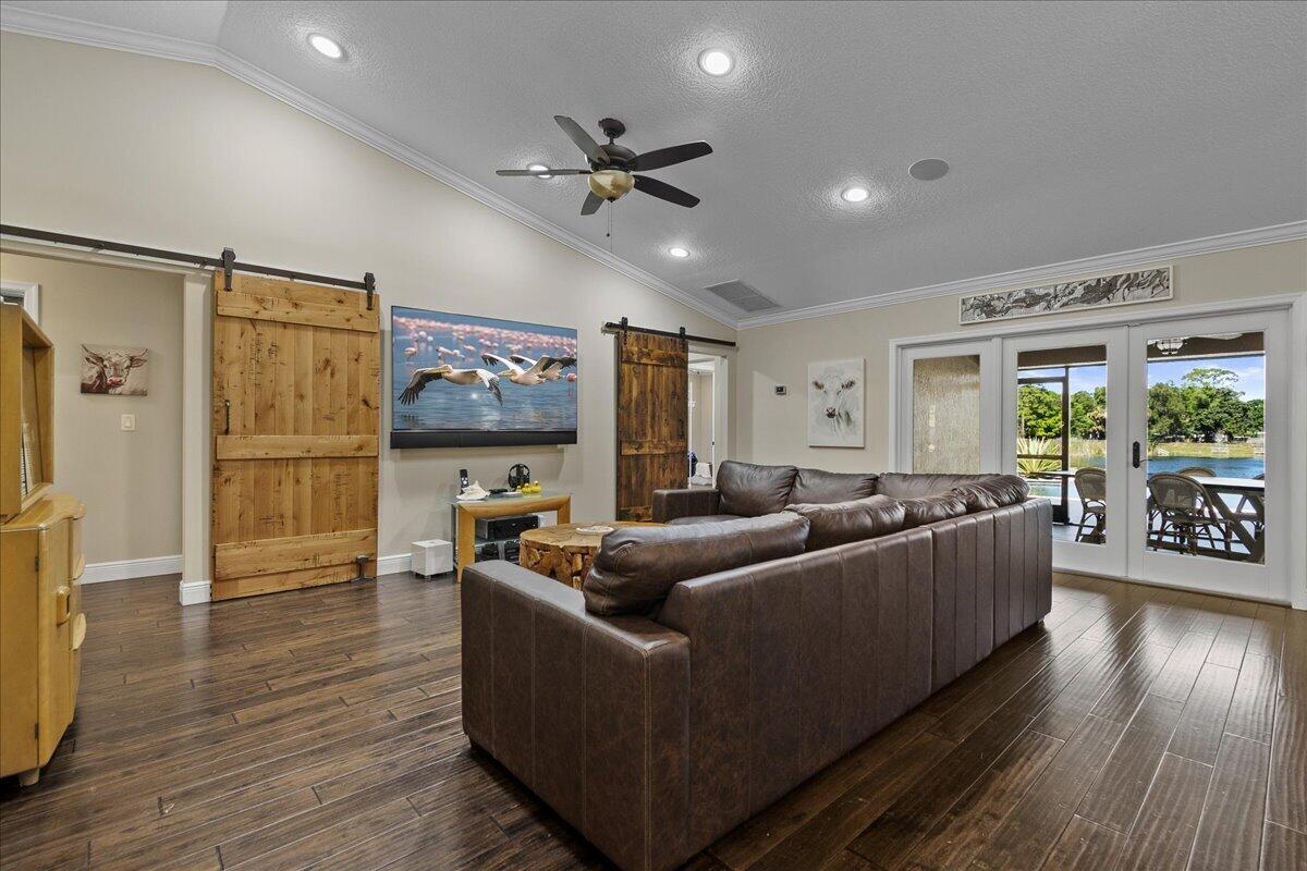 10975 Randolph Siding Road Jupiter, FL 33478 - Photo 18 of 97 a living room with furniture and a large window
