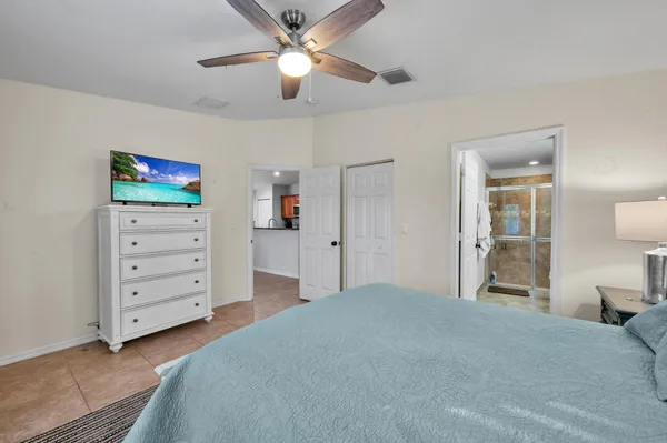 en empty room with fan and ceiling fan