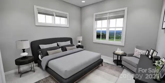 a bedroom with a bed window and couch