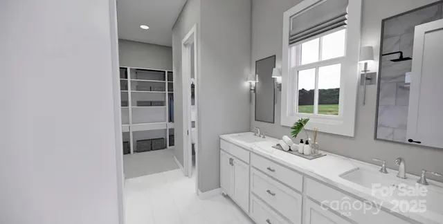 a spacious bathroom with a double vanity sink a mirror and a shower