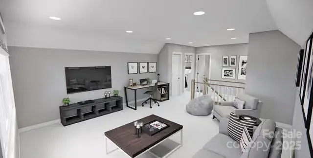 a living room with furniture a flat screen tv and kitchen view