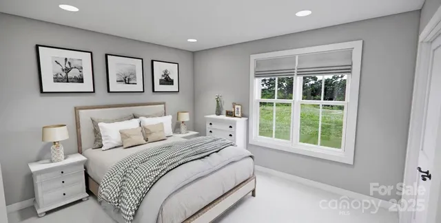 a bedroom with a large bed and a window