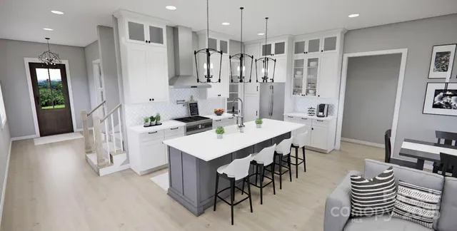 a large kitchen with a table and chairs