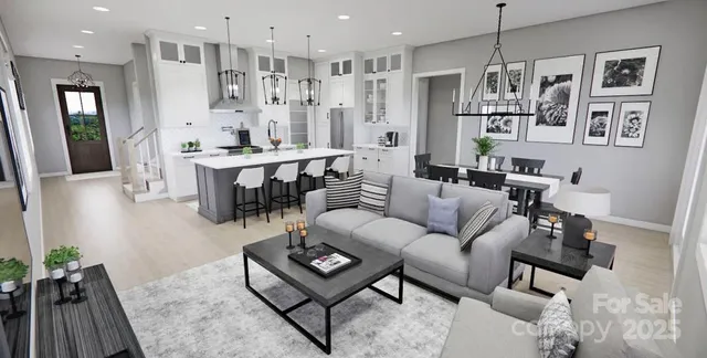 a living room with furniture kitchen view and a chandelier