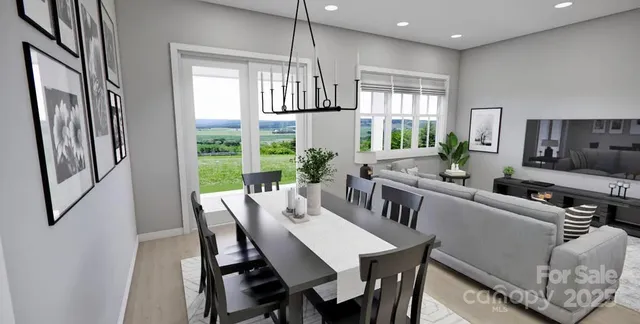 a view of a dining room with furniture window and outside view