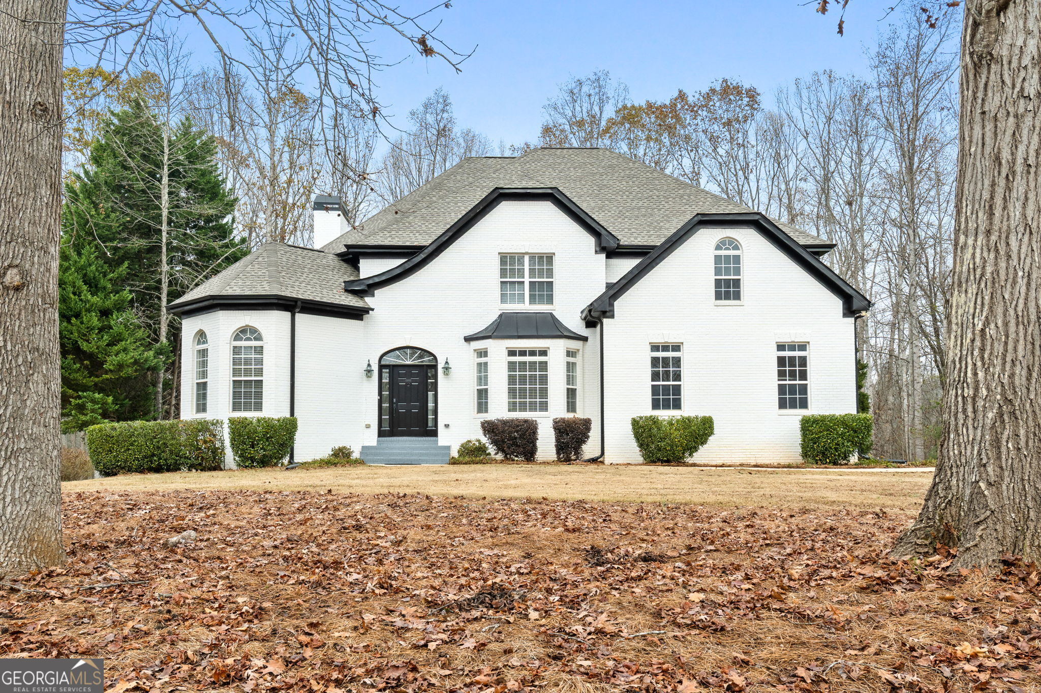 280 Antebellum Way Fayetteville, GA 30215 - Photo 1 of 65 a front view of a house with garden
