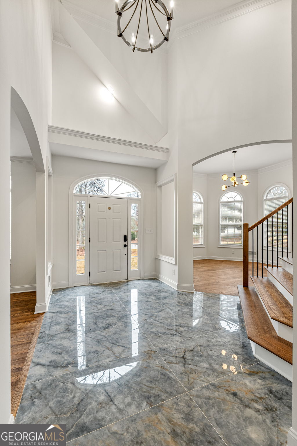 280 Antebellum Way Fayetteville, GA 30215 - Photo 17 of 65 a view of a hallway with wooden floor and a chandelier