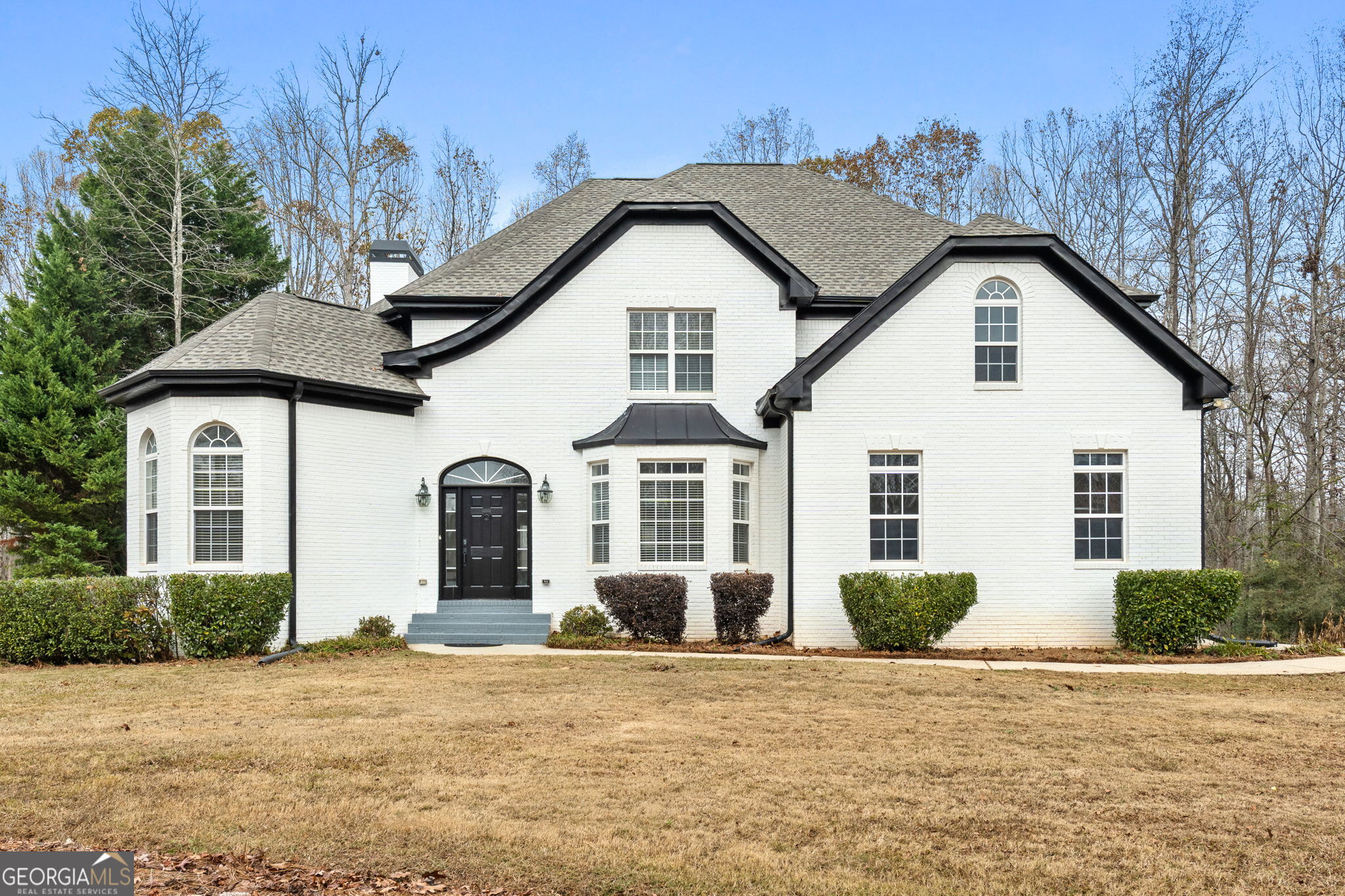 280 Antebellum Way Fayetteville, GA 30215 - Photo 19 of 65 a front view of a house with a yard and garage