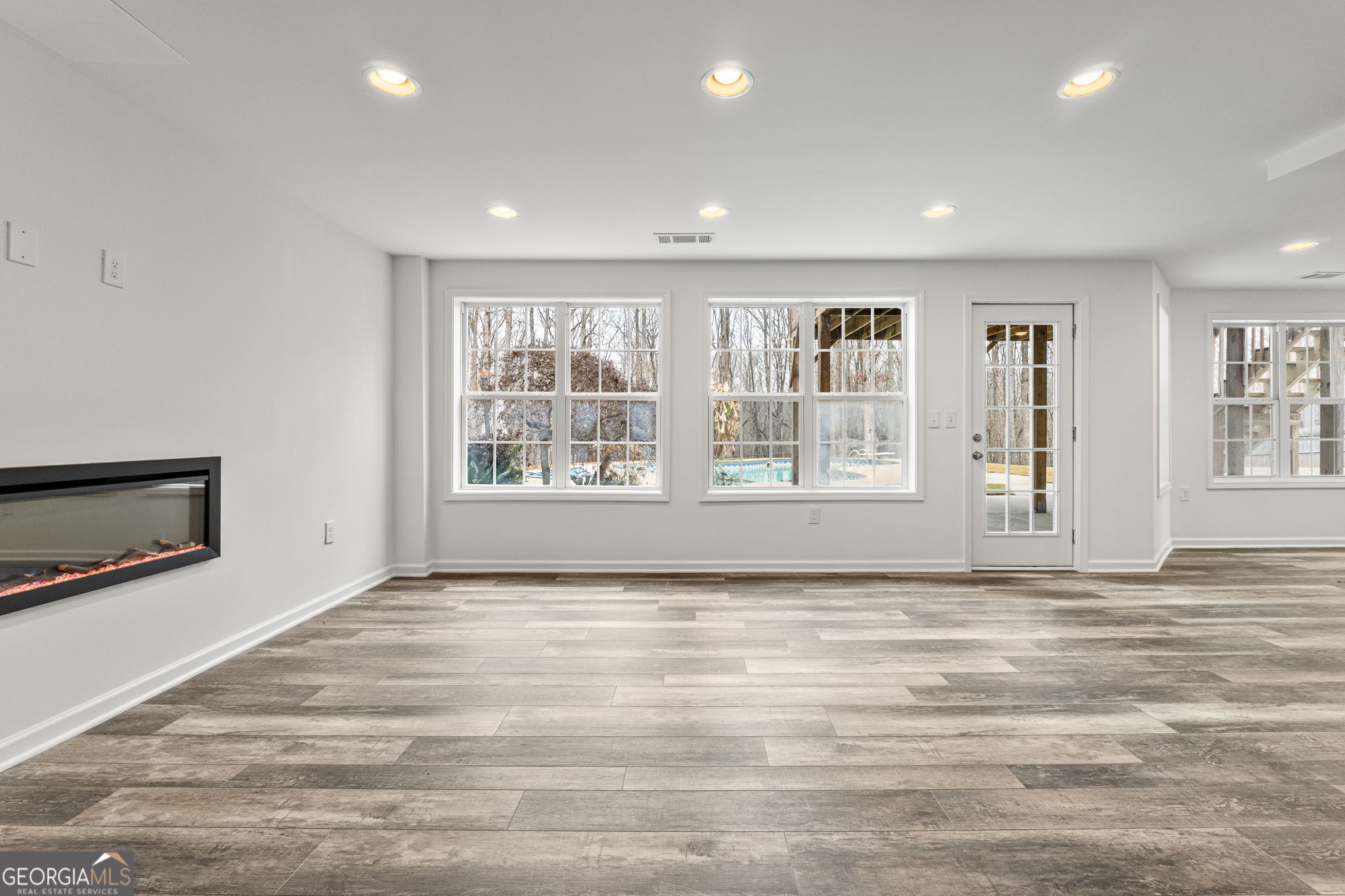 280 Antebellum Way Fayetteville, GA 30215 - Photo 20 of 65 a view of an empty room with a window and fireplace