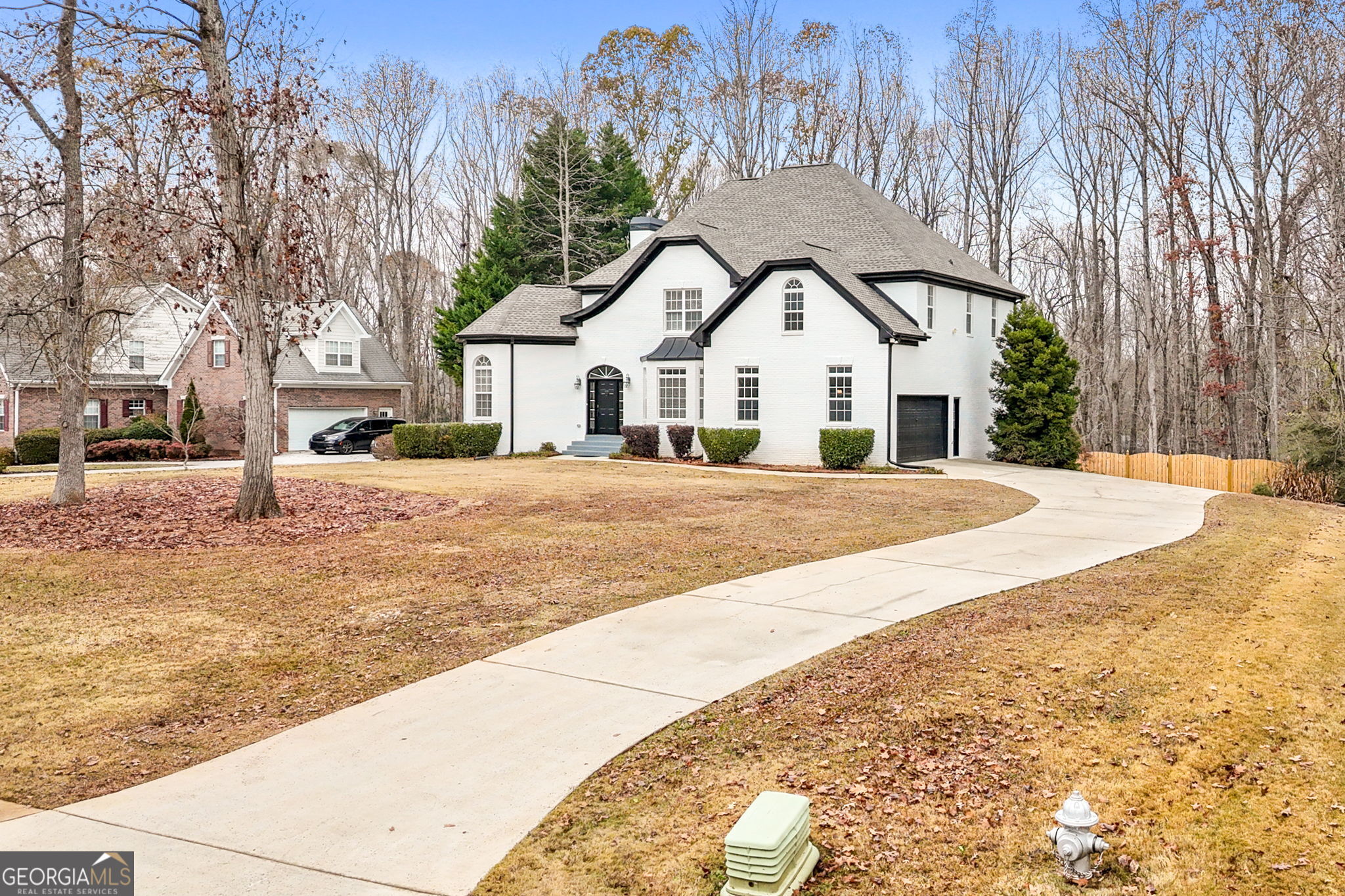 280 Antebellum Way Fayetteville, GA 30215 - Photo 2 of 65 a front view of a house with a yard and garage