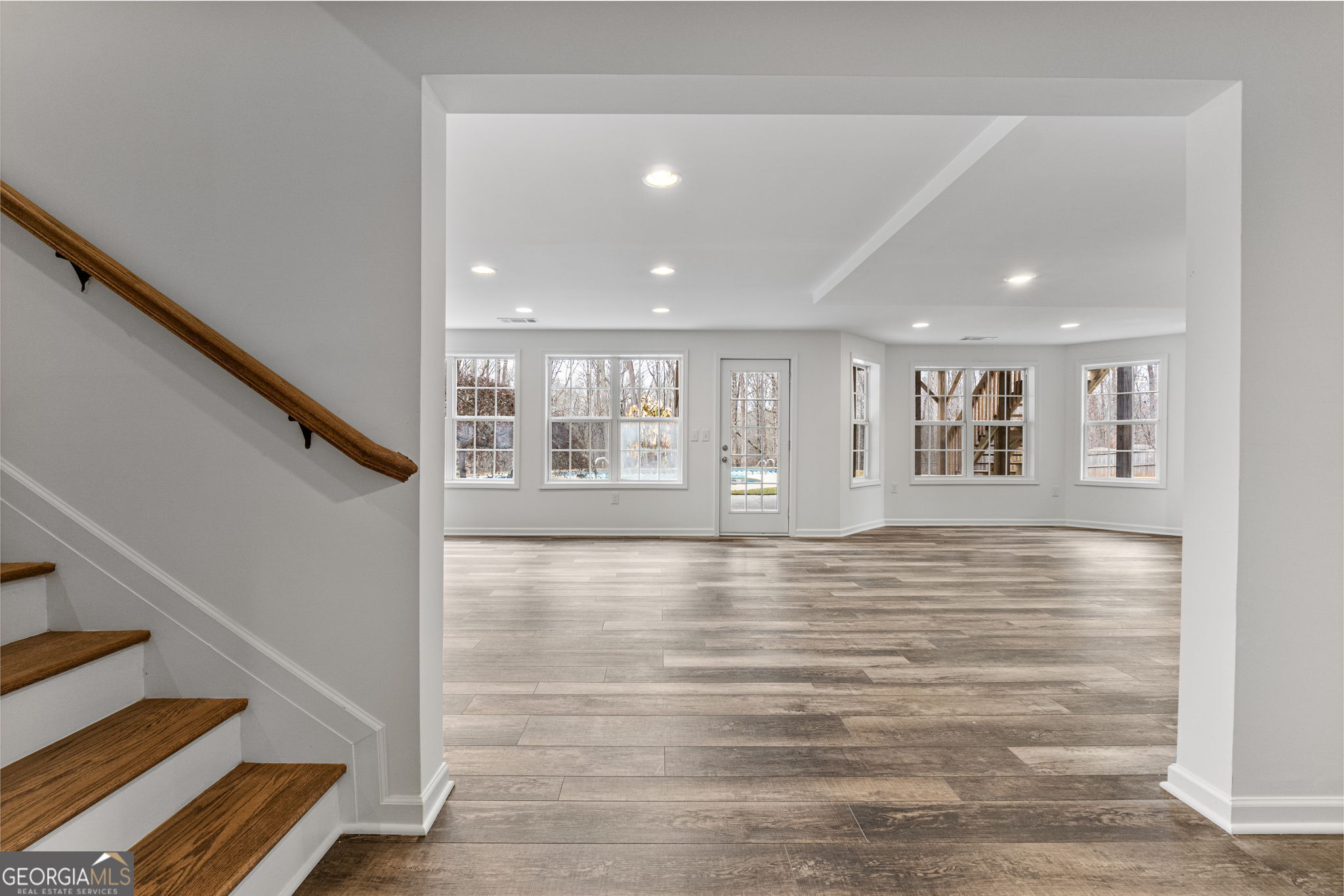 280 Antebellum Way Fayetteville, GA 30215 - Photo 22 of 65 a view of an empty room with wooden floor and stairs