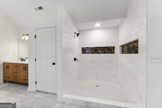 a kitchen with stainless steel appliances granite countertop a stove refrigerator sink and cabinets