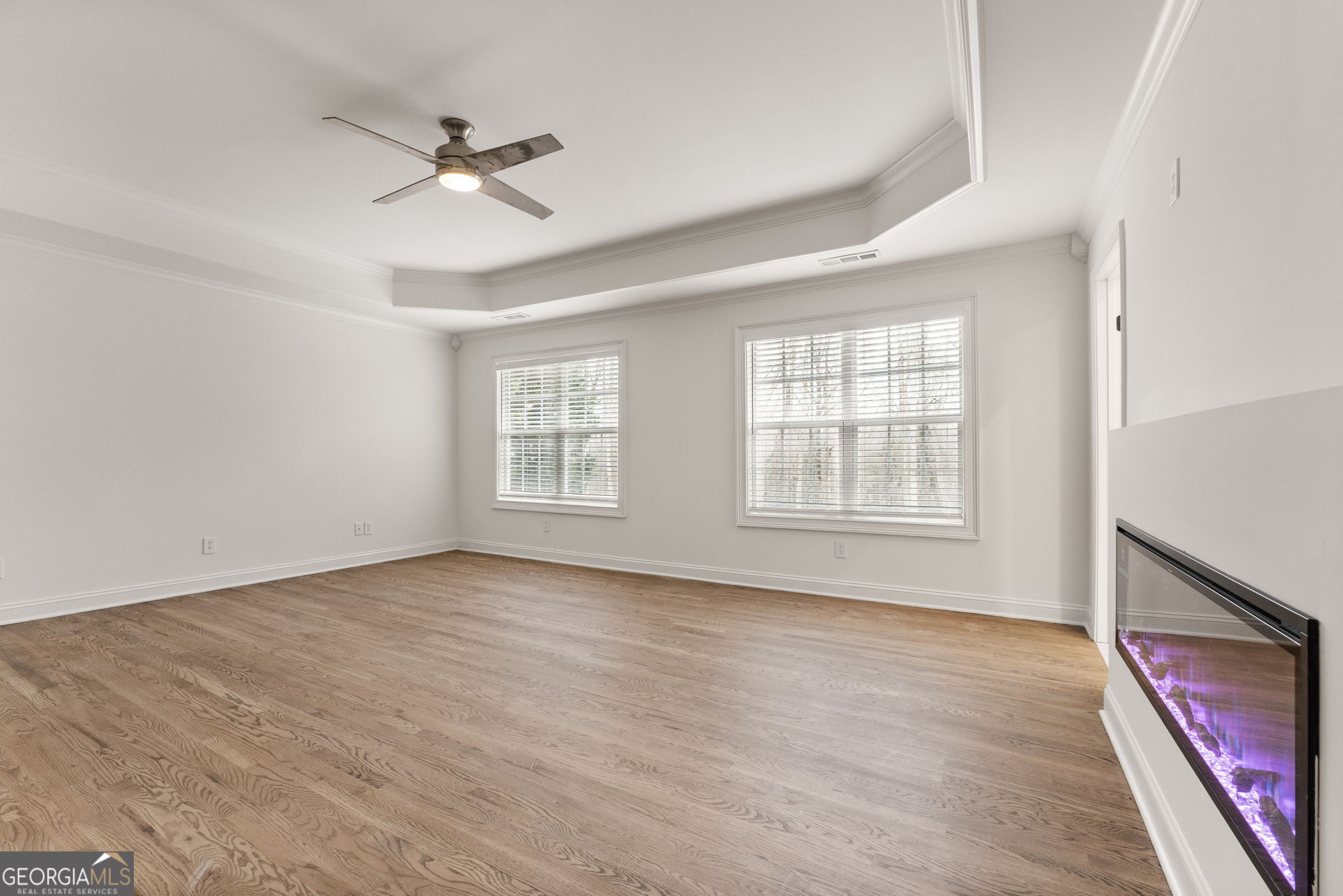 280 Antebellum Way Fayetteville, GA 30215 - Photo 32 of 65 a view of an empty room with a window and wooden floor