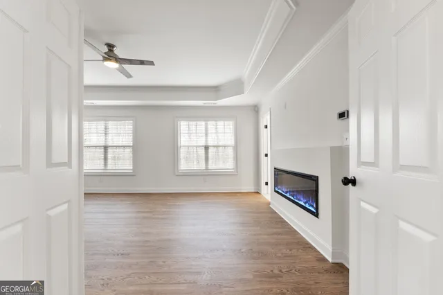 a view of a livingroom with a sink and window