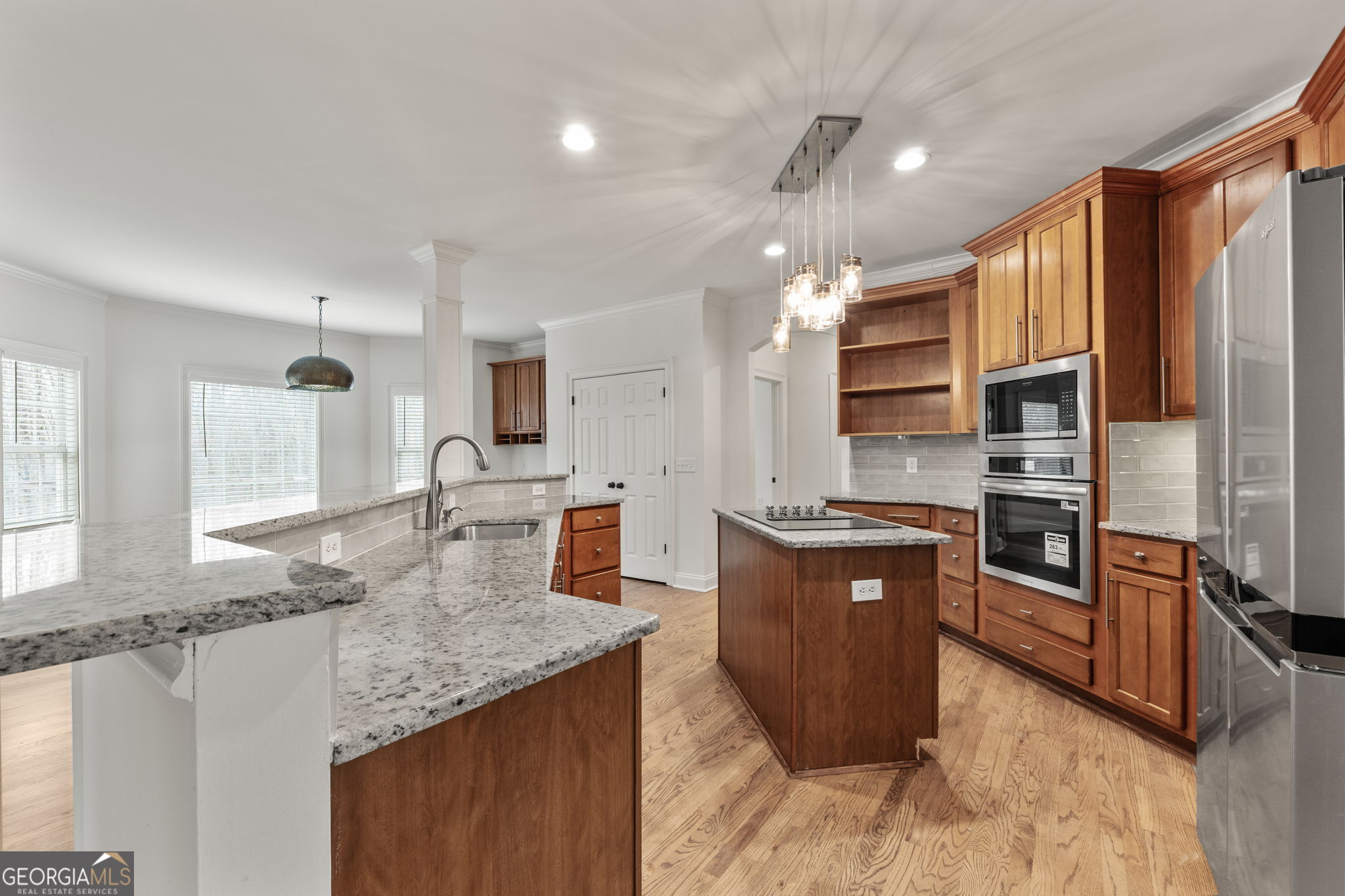 280 Antebellum Way Fayetteville, GA 30215 - Photo 36 of 65 a kitchen with stainless steel appliances granite countertop a sink stove and refrigerator