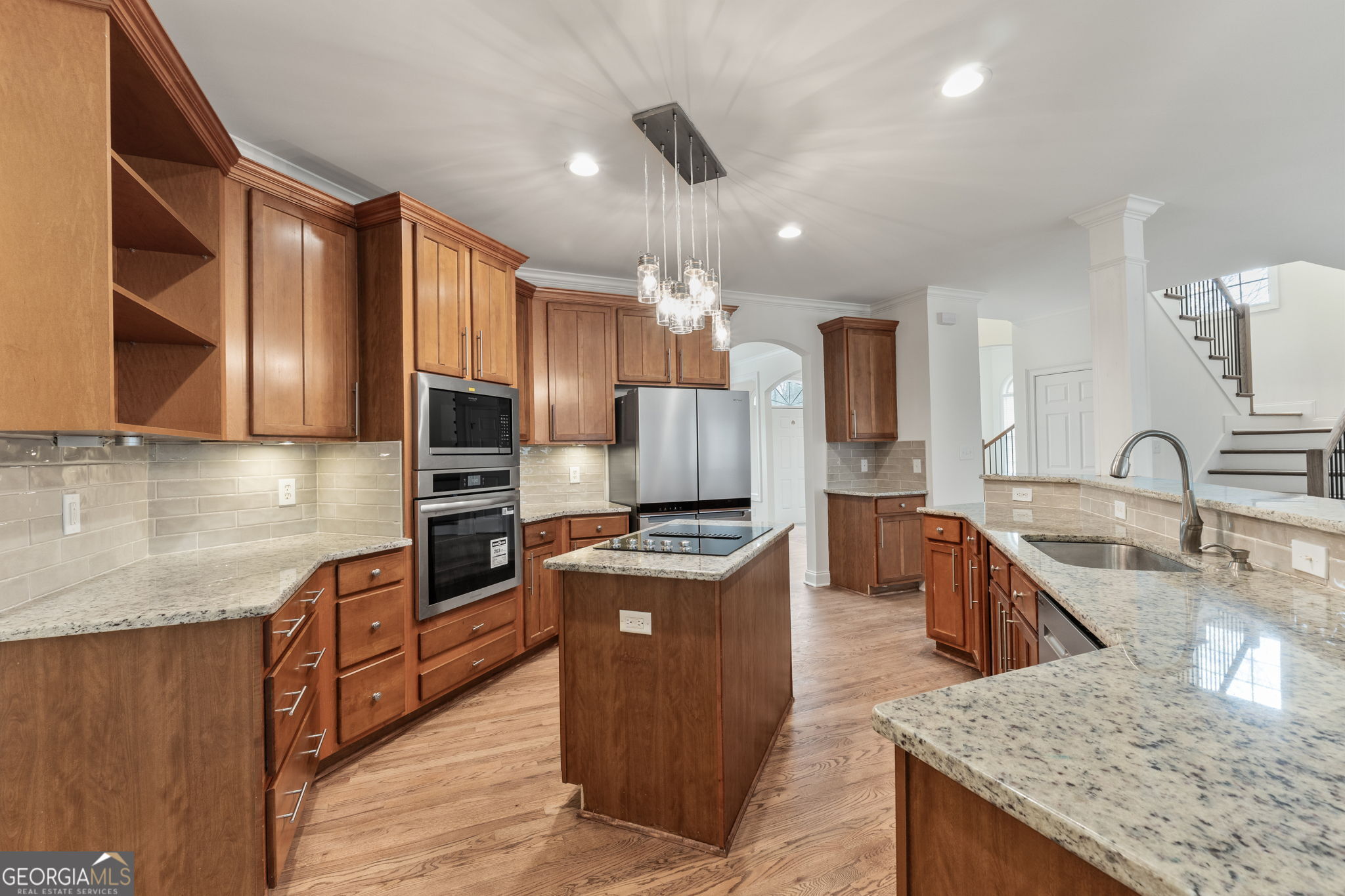 280 Antebellum Way Fayetteville, GA 30215 - Photo 37 of 65 a kitchen with granite countertop a sink a counter top space stainless steel appliances and cabinets