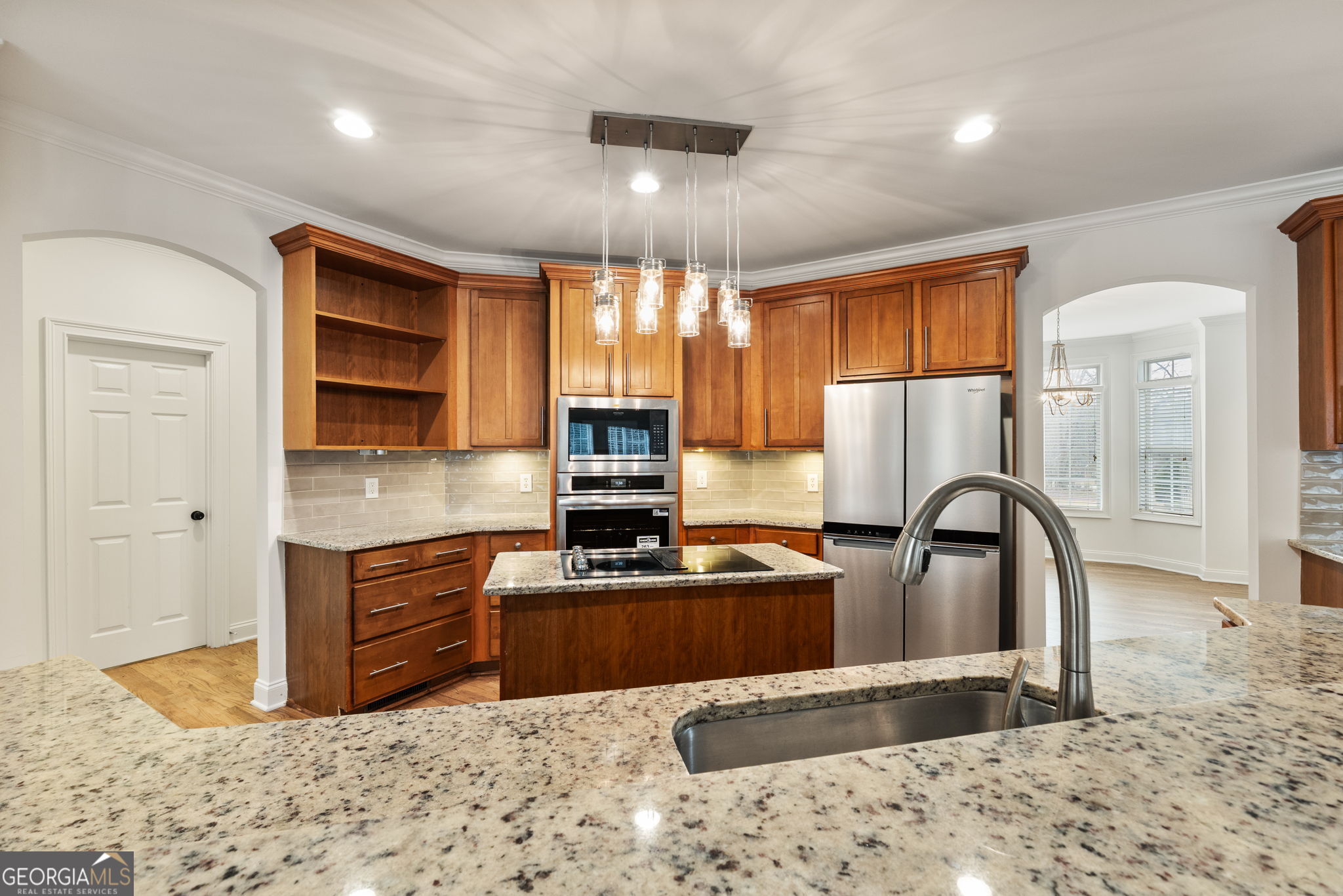 280 Antebellum Way Fayetteville, GA 30215 - Photo 38 of 65 a kitchen with stainless steel appliances granite countertop a stove refrigerator sink and cabinets