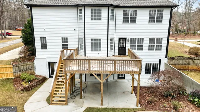a view of a hallway with wooden floor and entryway