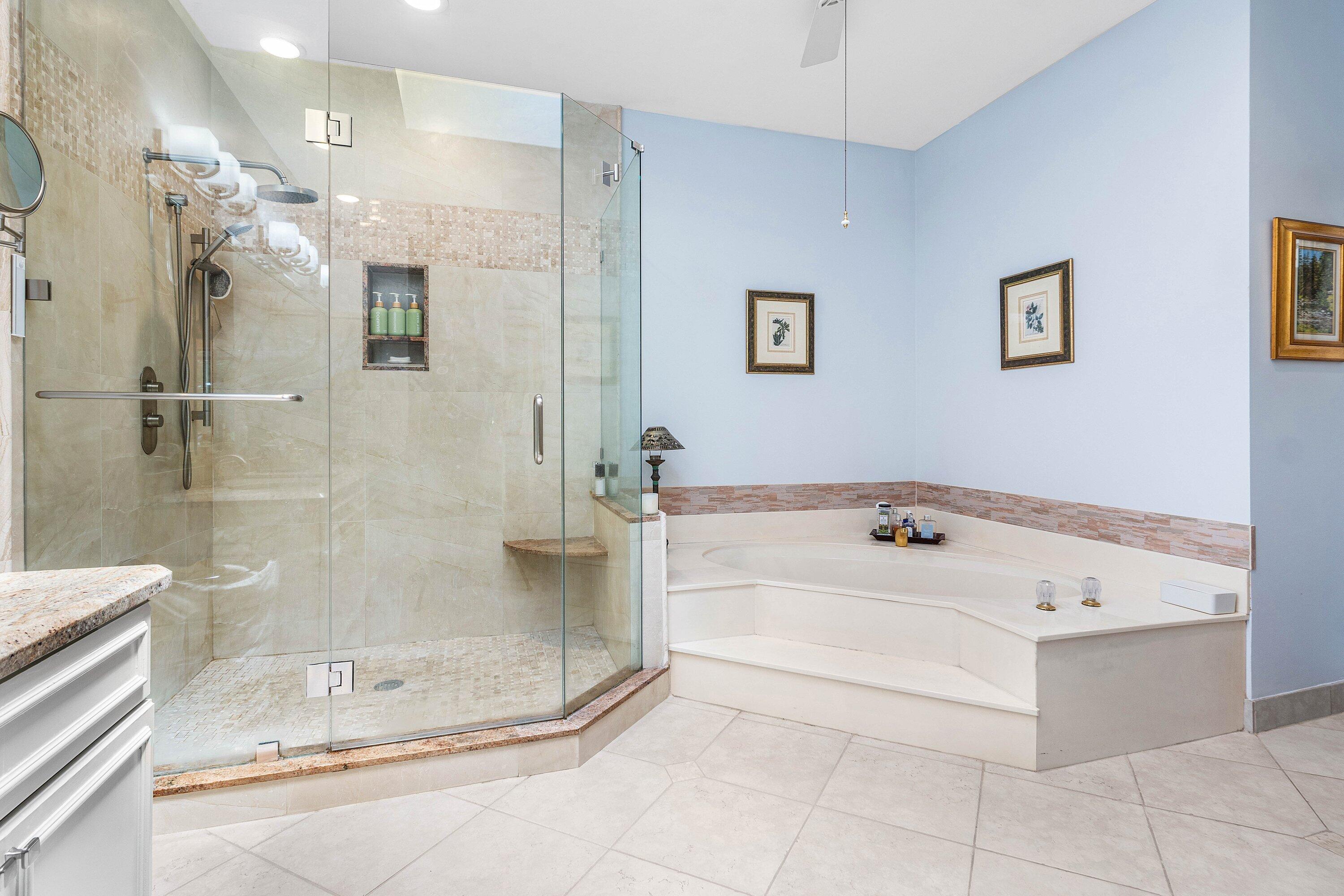 6514 Via Rosa Boca Raton, FL 33433 - Photo 19 of 27 a bathroom with a tub a sink and shower