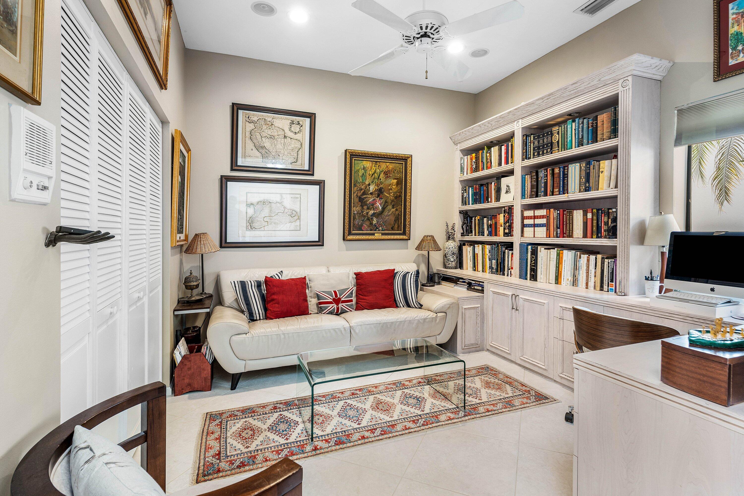 6514 Via Rosa Boca Raton, FL 33433 - Photo 24 of 27 a living room with furniture and a book shelf