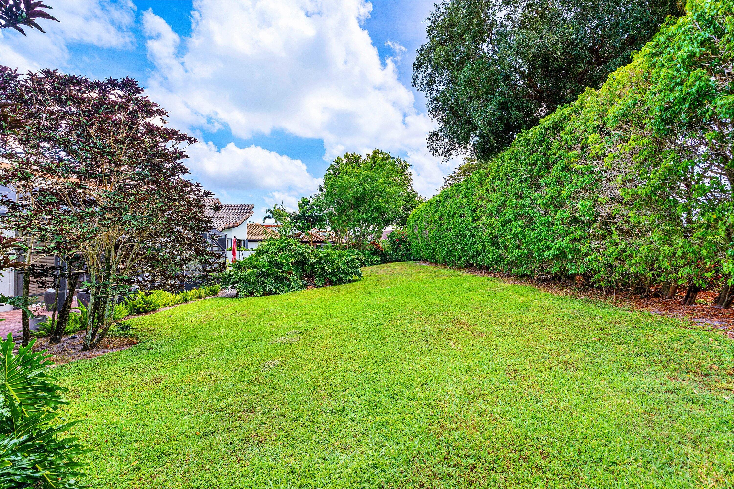 6514 Via Rosa Boca Raton, FL 33433 - Photo 27 of 27 a view of a field of grass and trees