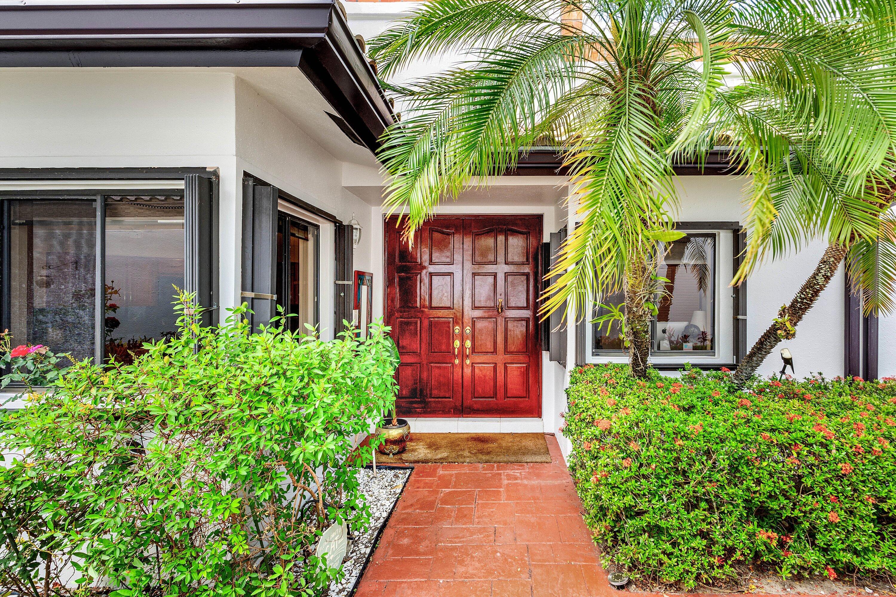 6514 Via Rosa Boca Raton, FL 33433 - Photo 5 of 27 a front view of a house having yard