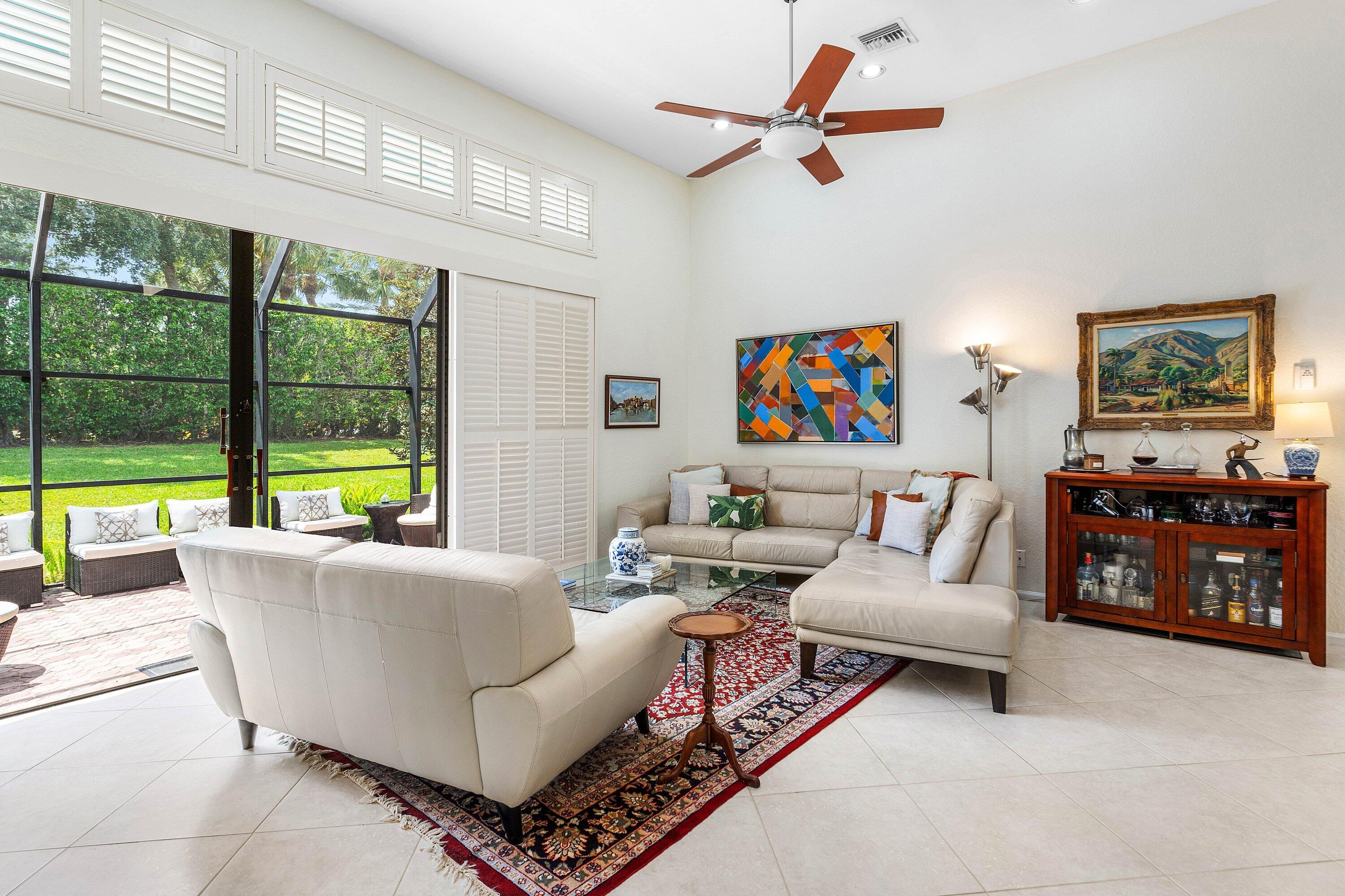 6514 Via Rosa Boca Raton, FL 33433 - Photo 8 of 27 a living room with furniture and a large window