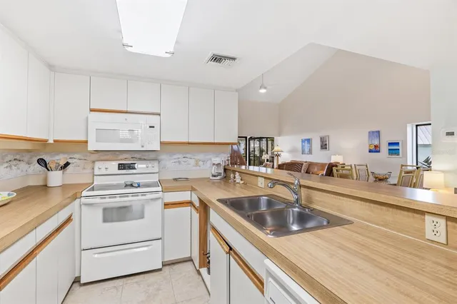 a kitchen that has a sink and a stove