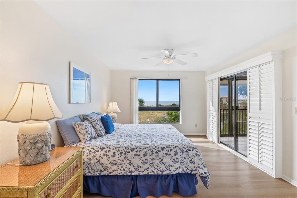 5000 Gasparilla Road, Unit 76B Boca Grande, FL 33921 - Photo 17 of 44 a bedroom with a large bed and a window