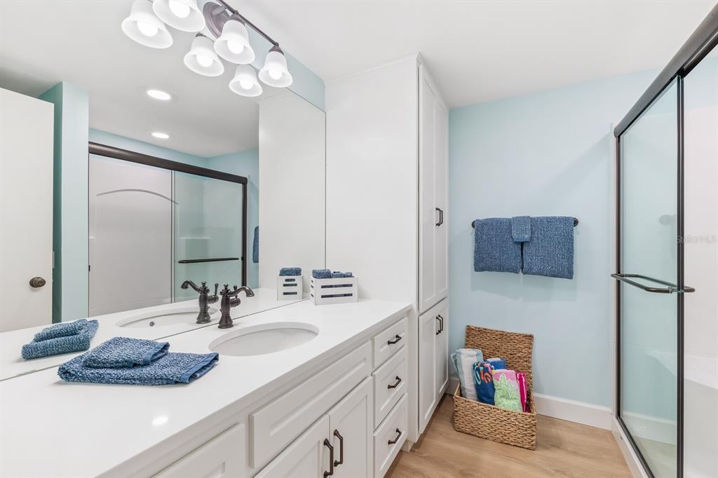 5000 Gasparilla Road, Unit 76B Boca Grande, FL 33921 - Photo 18 of 44 a bathroom with a sink double vanity and a mirror