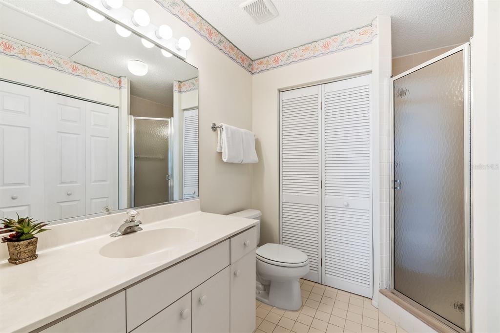 5000 Gasparilla Road, Unit 76B Boca Grande, FL 33921 - Photo 22 of 44 a bathroom with a sink a toilet and shower