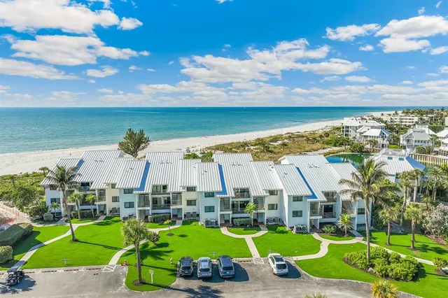 a view of a big yard with lawn chairs