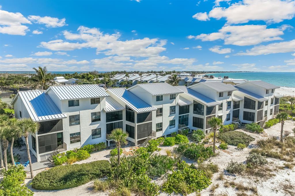 5000 Gasparilla Road, Unit 76B Boca Grande, FL 33921 - Photo 4 of 44 a view of a big yard in front of the house