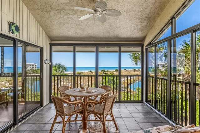 a view of a balcony with furniture